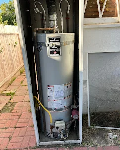 Bert's Mega Plumbing technician installing a tankless water heater in a San Fernando Valley home